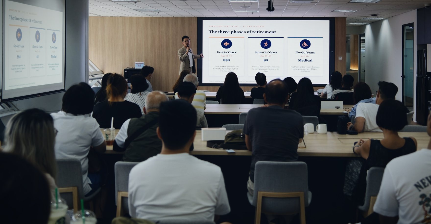 Bryan Ching speaking on the three phases of retirement to a full room in Singapore